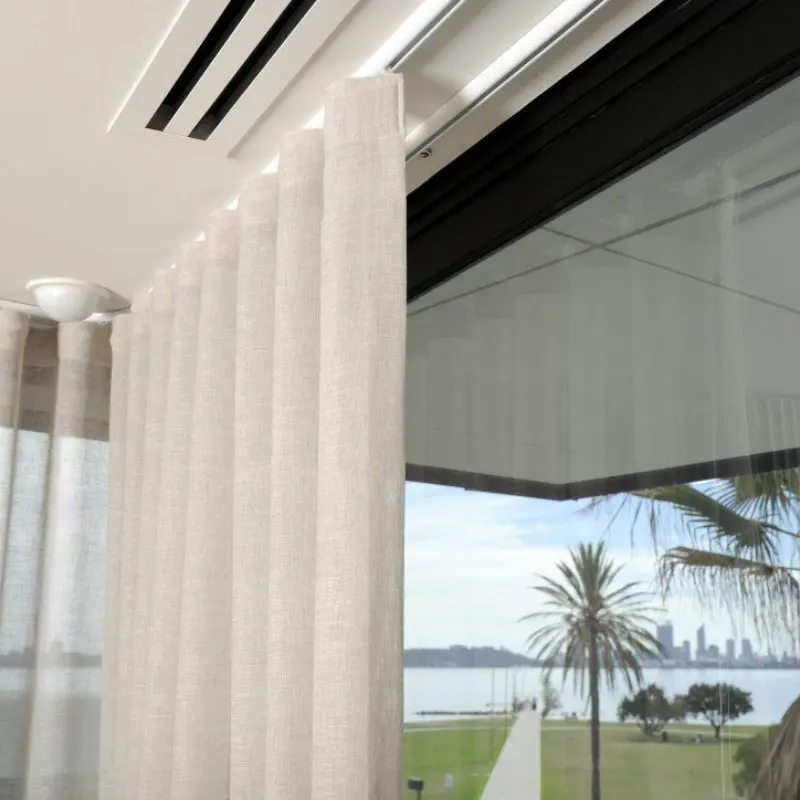 Interior application of custom thin-wall aluminum extrusion used as a ceiling-mounted curtain track system, demonstrating lightweight and precision engineering.