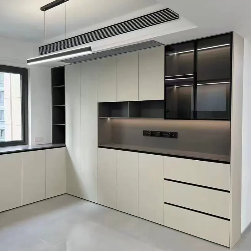 Modern kitchen cabinetry utilizing thin-wall aluminum hollow profiles for structural frames and edge banding, showcasing custom OEM extrusion capabilities for the furniture industry.