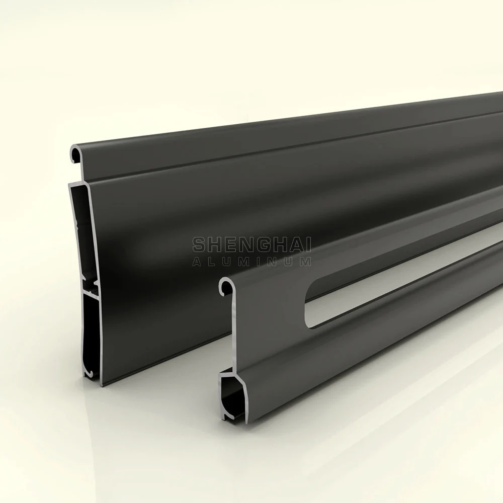 Perforated dark grey extruded aluminum roller shutter slat with ventilation slots for commercial and industrial applications.