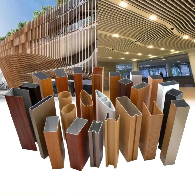 Various custom aluminum hollow extrusions including wood grain baffle profiles and rectangular tubes, used for commercial architectural facades and suspended ceiling systems.